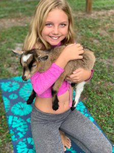Goat Yoga with baby goats is thoroughly enjoyed by kids.